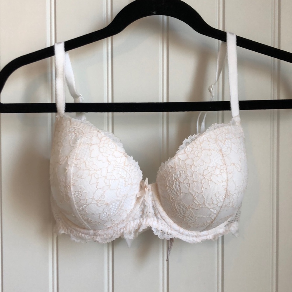 White & pale pink lace bra